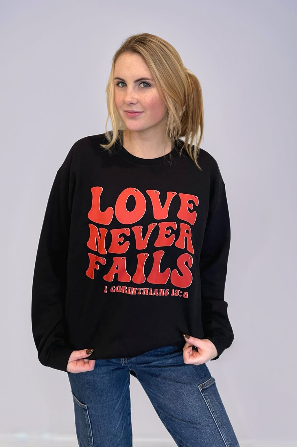 Love Never Fails Sweatshirt